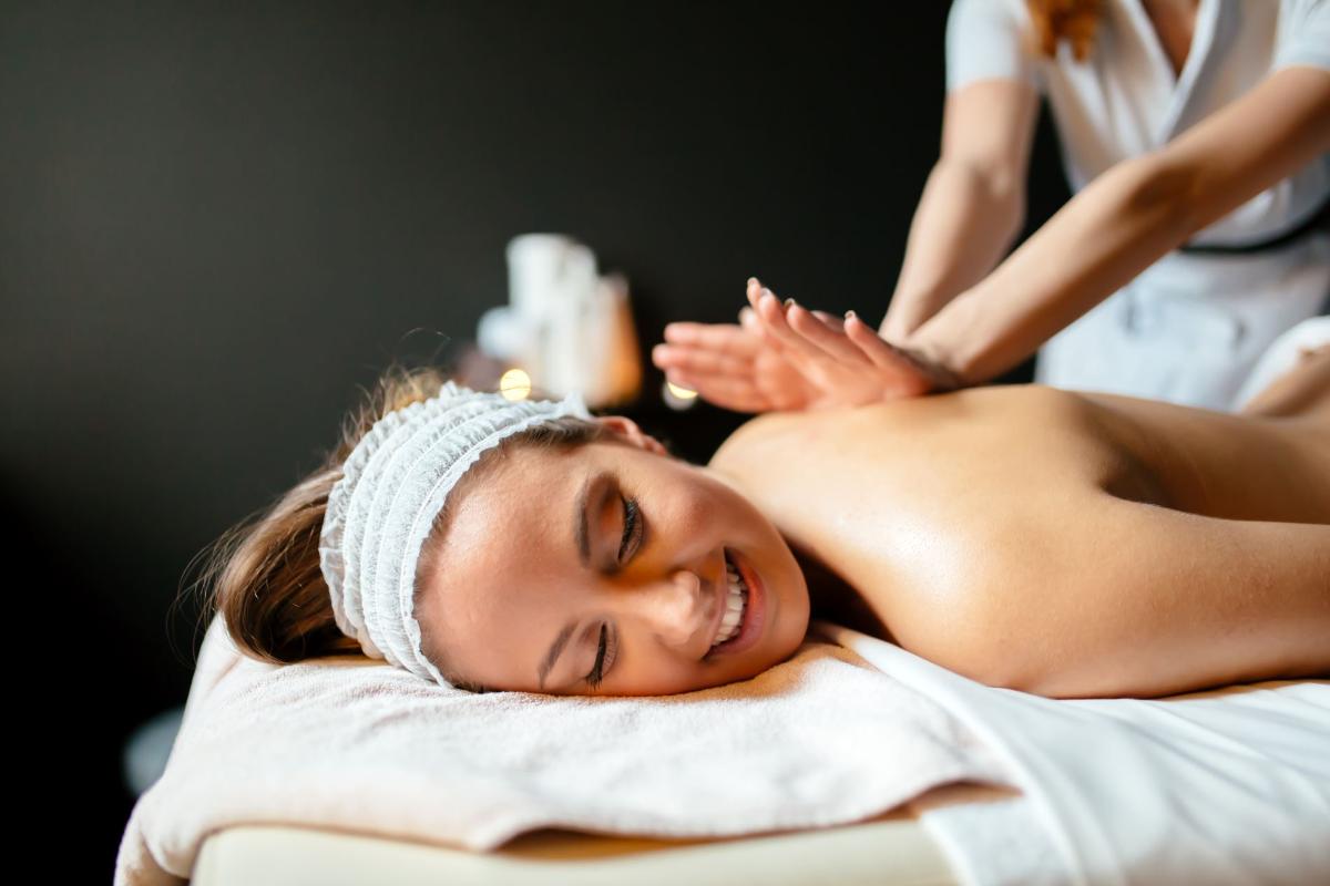 massage-therapist-massaging-woman-awn6qat.jpg